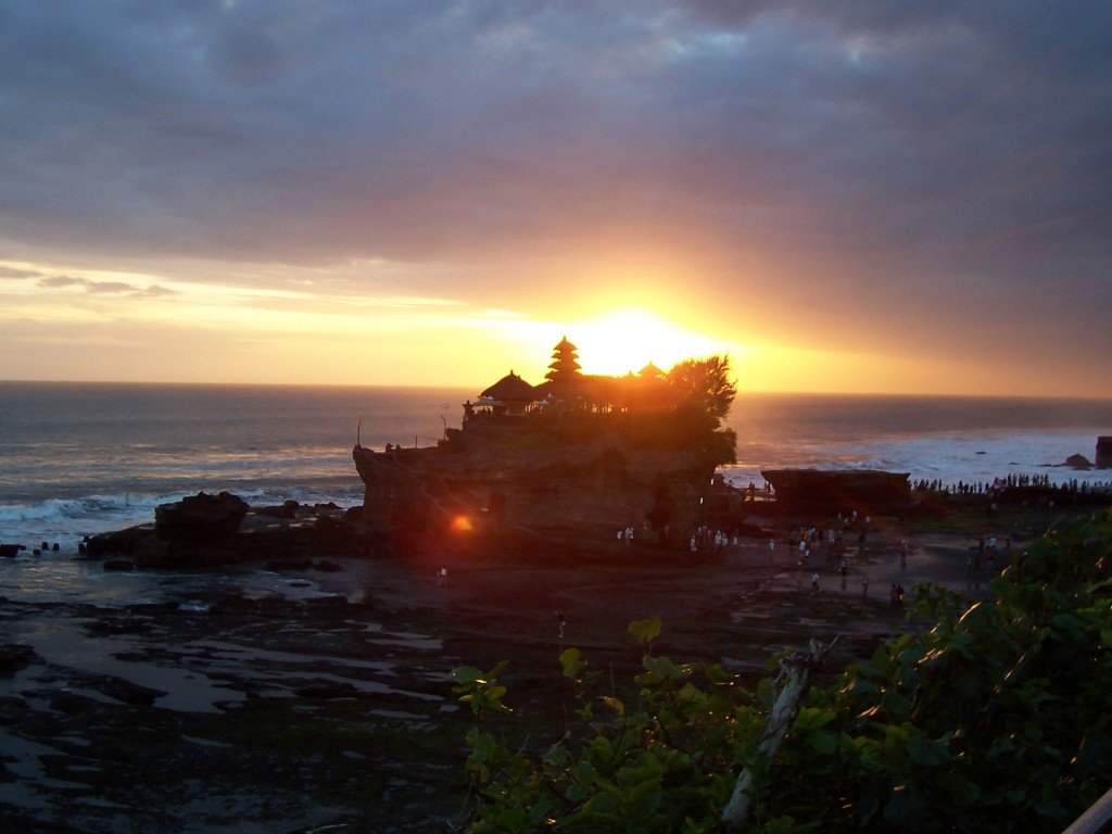 The wonderful Tanah Lot temple at beautiful stunning looks in sunset view in Beraban village,Tabanan regency, Bali island - Mari Bali Tours 